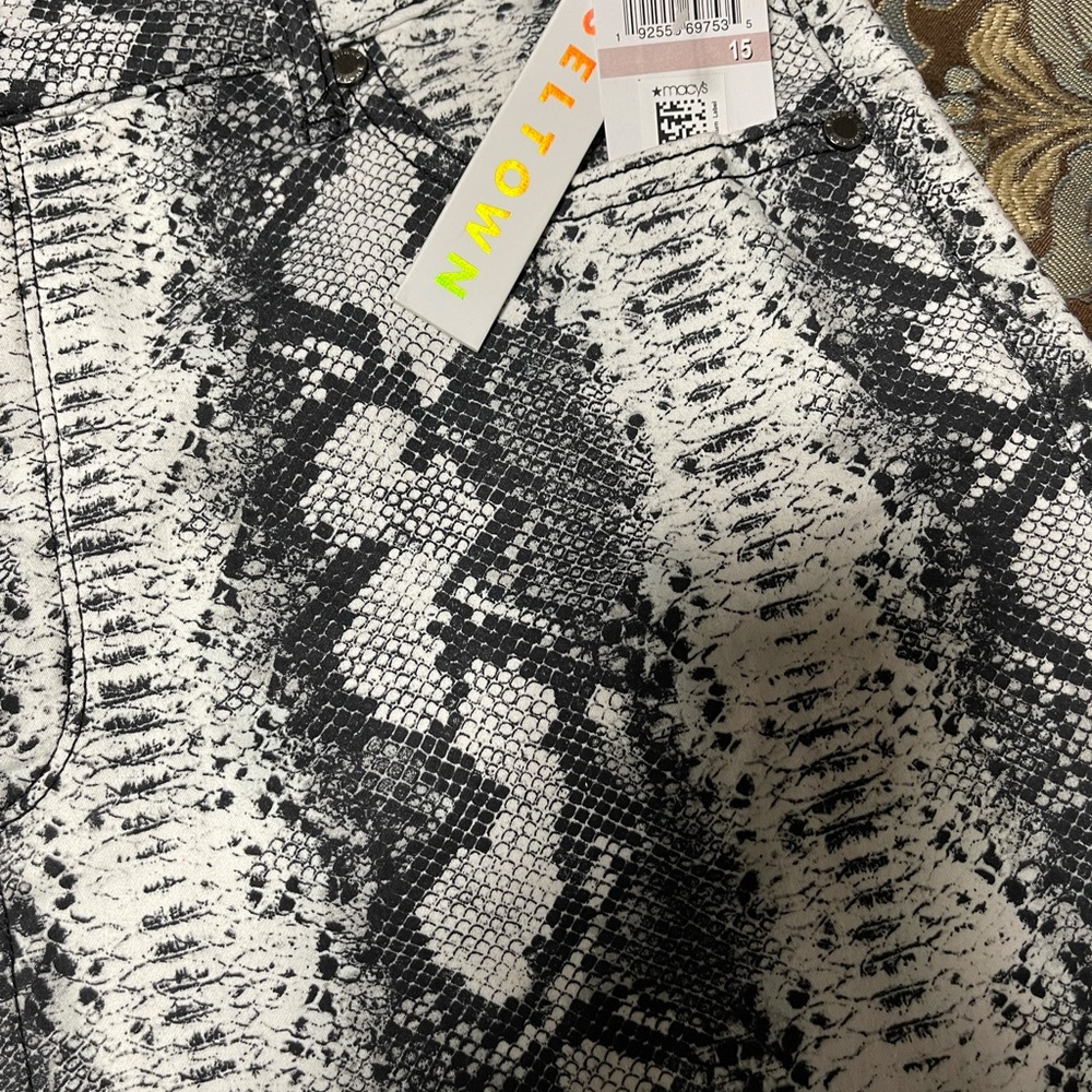 Black and white snakeskin and python print mini skirt